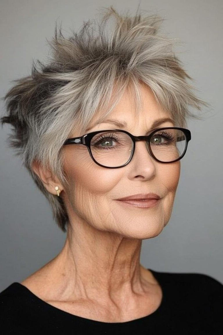 Grey tousled pixie haircut with wispy fringe and glasses for older women