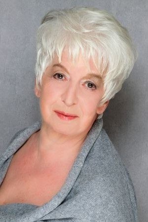 Fluffy white pixie haircut with soft wispy edges