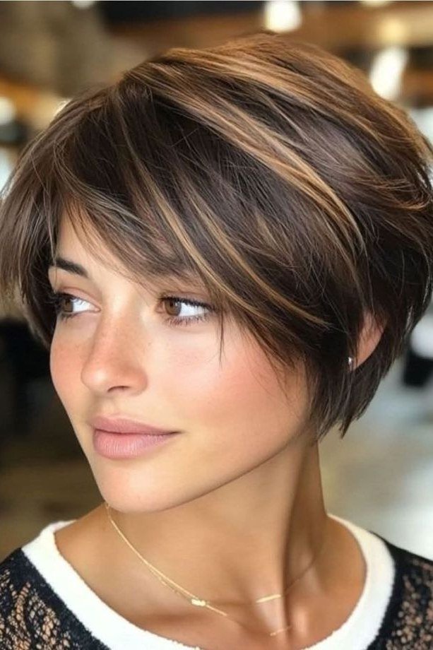 Side-Swept Brunette Pixie with Soft Highlights - pixie hairstyle for women over 40