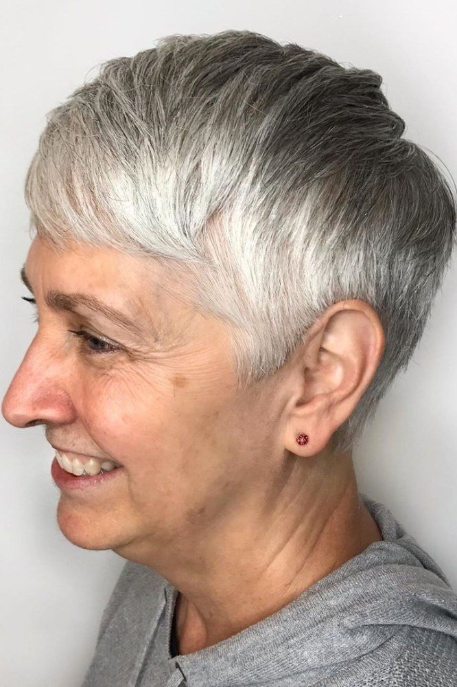Silver pixie haircut with soft bangs, side view, for women over 60