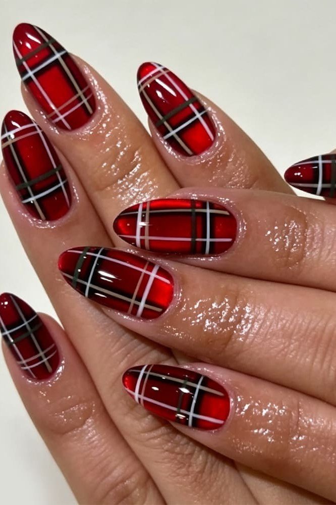 Red buffalo plaid nail design on glossy almond nails for women over 50