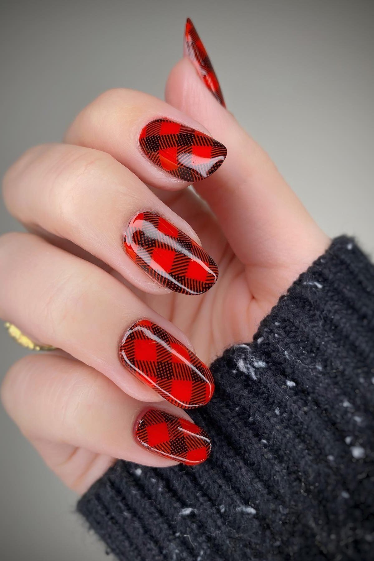 Red and black buffalo check plaid nails on almond shaped nails