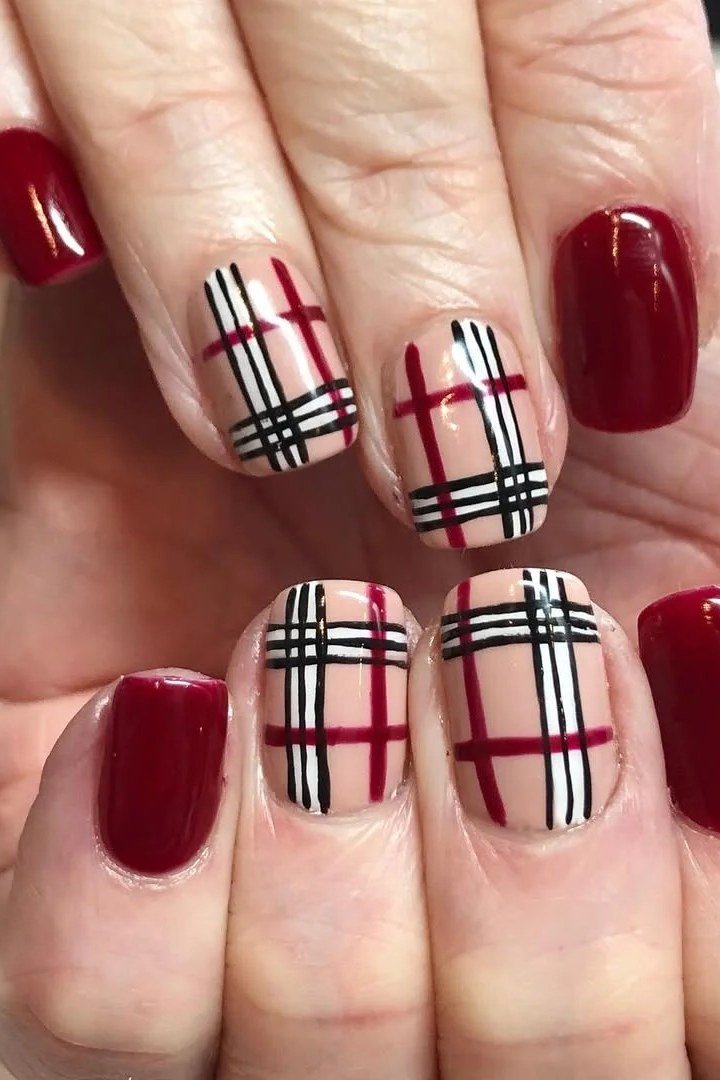 Cherry red nails with beige and black plaid on squoval nails