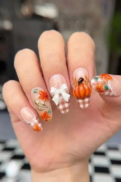 Harvest pumpkin and autumn leaf nail art with orange gingham
