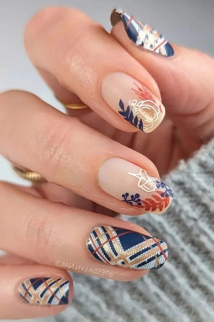 Navy plaid nails with autumn leaf nail art