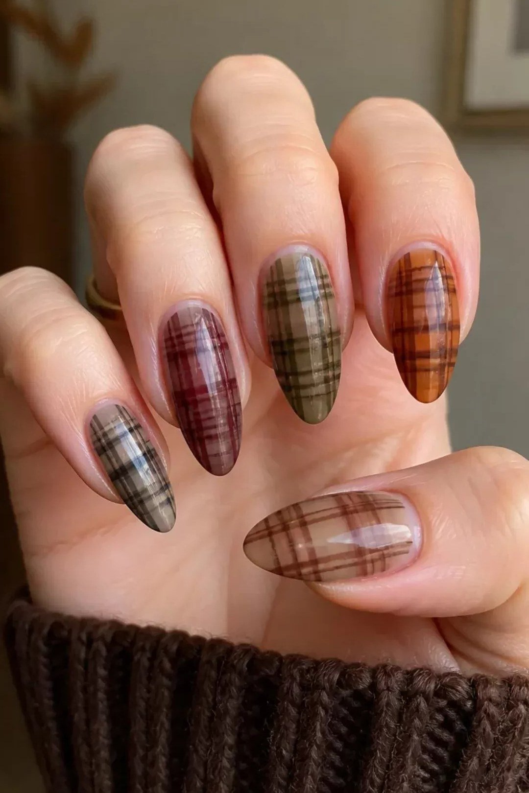 Brown black and olive plaid nails on almond nails