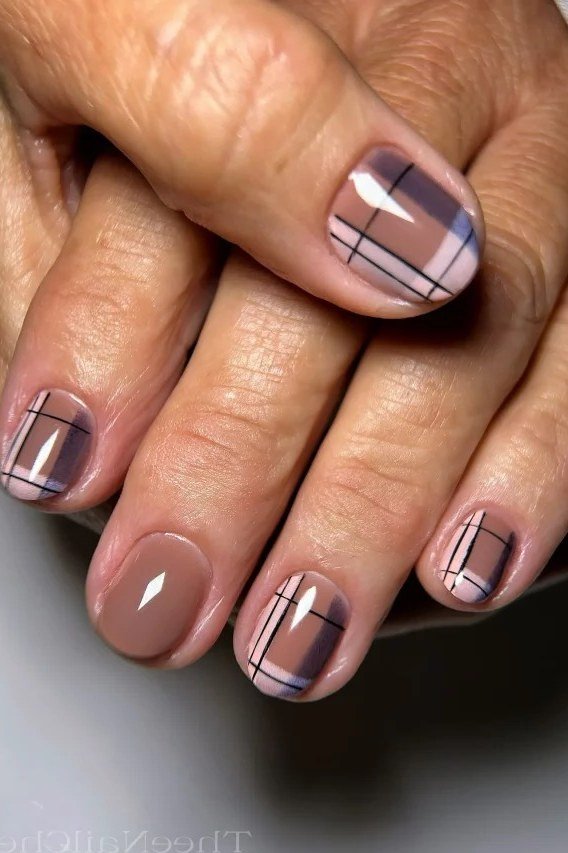 Taupe plaid nails on elegant mature hands over 50