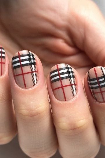 Beige red and black plaid nails on round nails