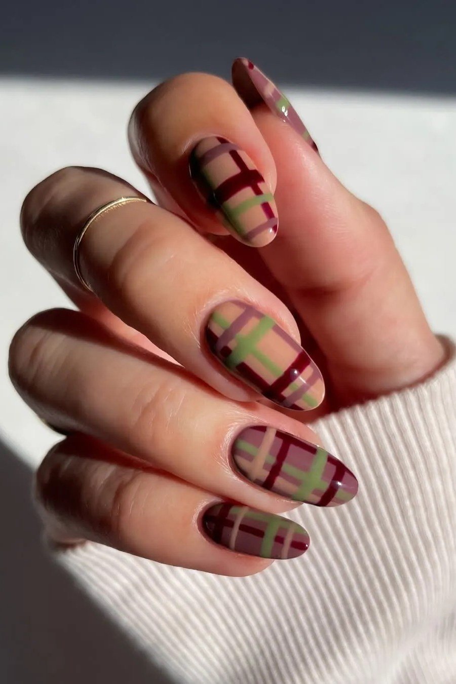 Olive green and burgundy plaid on almond nails