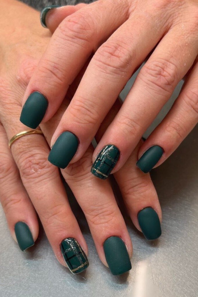 Matte evergreen nails with subtle plaid accents