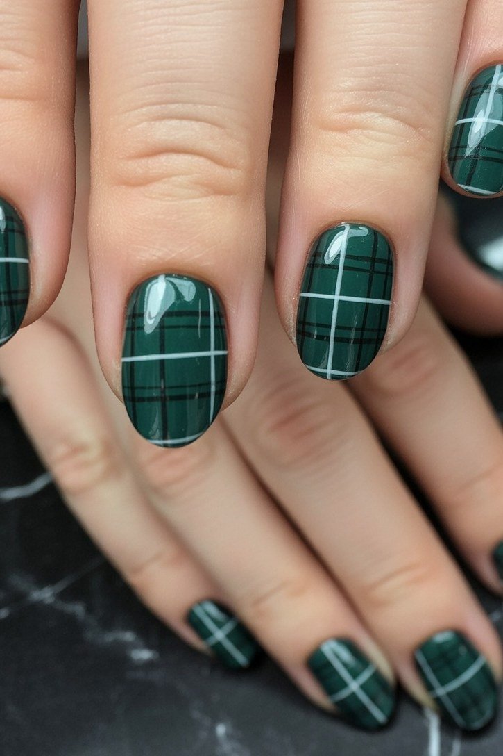 Emerald green windowpane plaid on glossy almond nails
