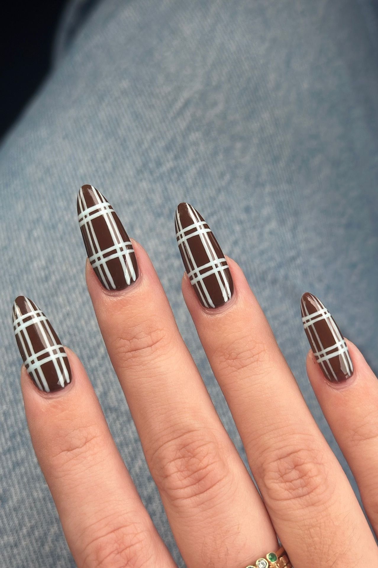Brown and white gingham on long stiletto nails
