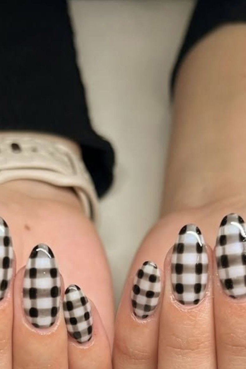 Black and white buffalo check plaid on almond nails