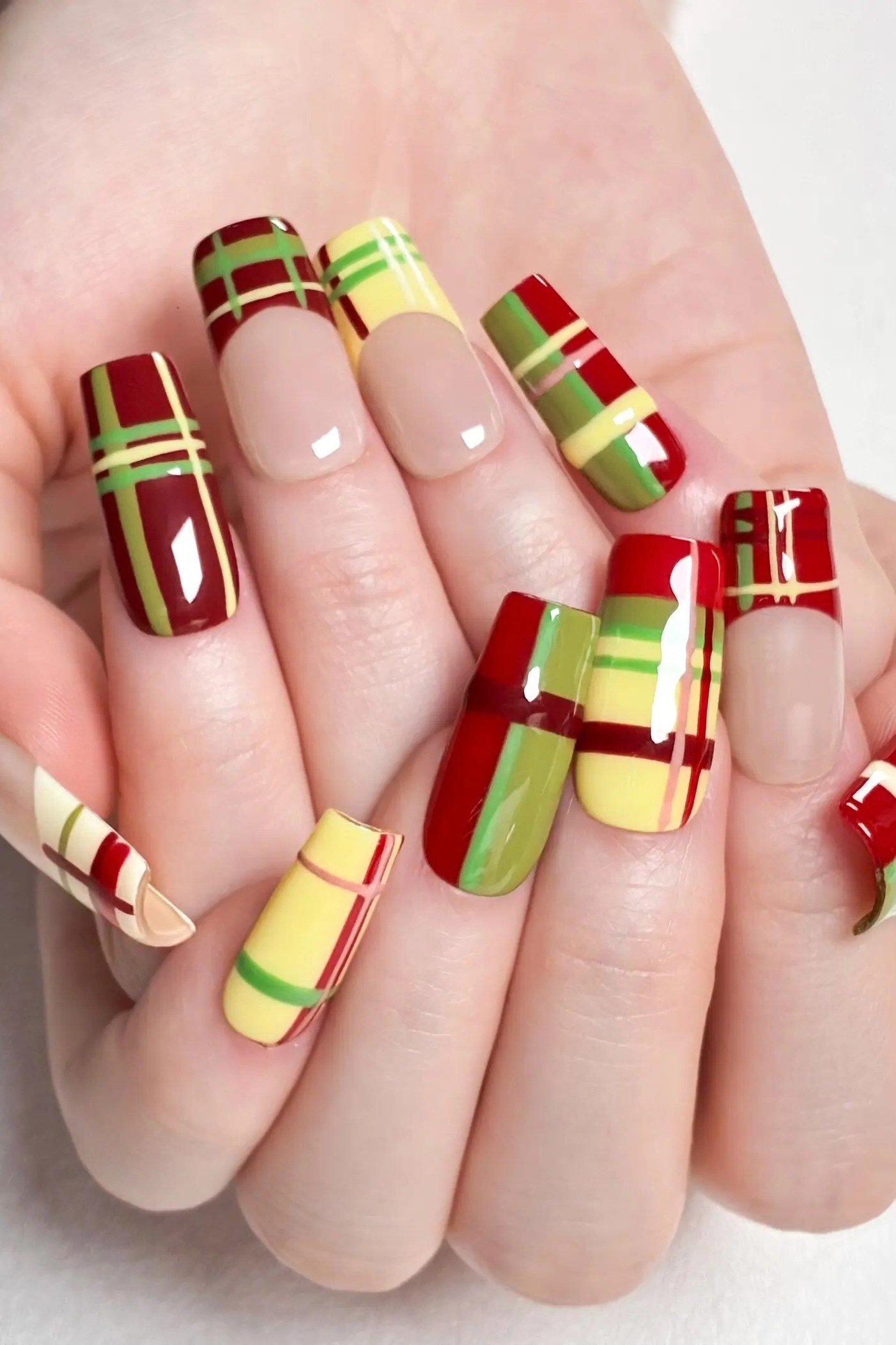 Red yellow and green madras plaid on squoval nails
