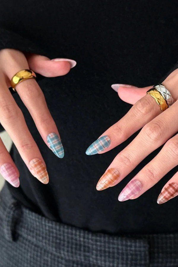 Soft blue and pink plaid tip nails on almond nails
