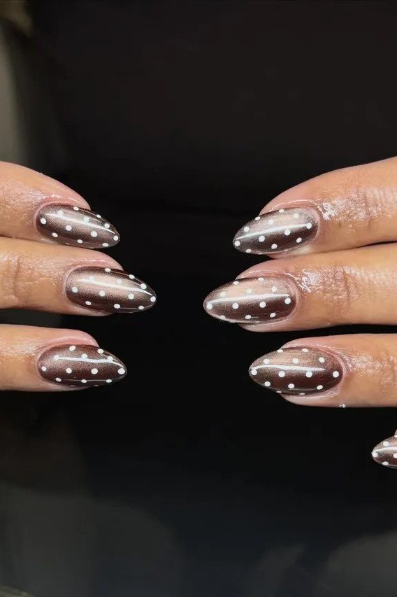 Grey champagne cat-eye nails with white dotted French tips, elegant fall nail design