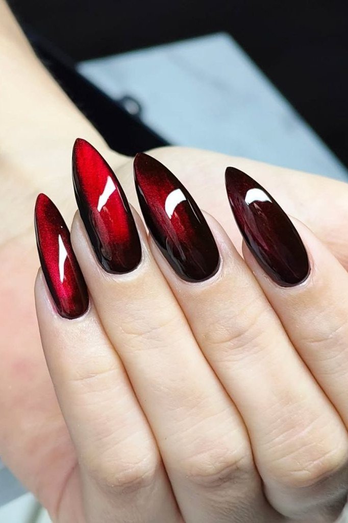 Glossy red cat-eye stiletto nails, bold fall nail design