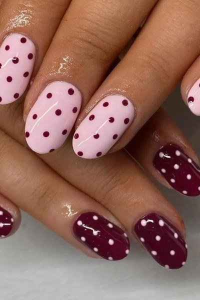 Pink and oxblood almond nails with polka dots, two tone fall nail art