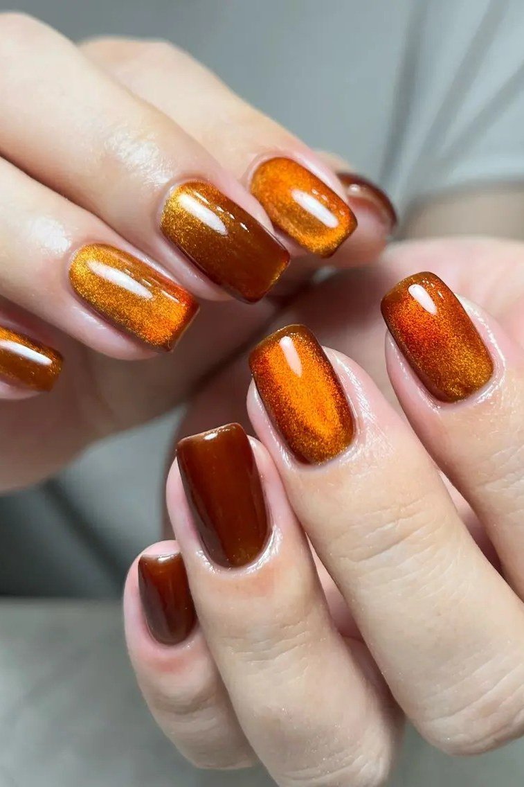 Burnt orange cat-eye almond nails, autumn fall nail design for women over 50