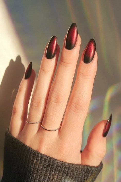 Red and black cat-eye almond nails, bold fall nail design