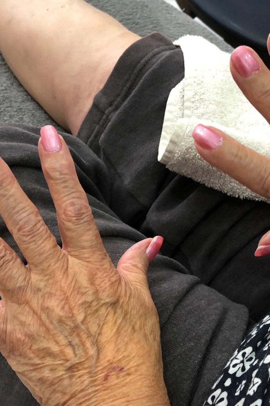 Mature hand with soft pink nails