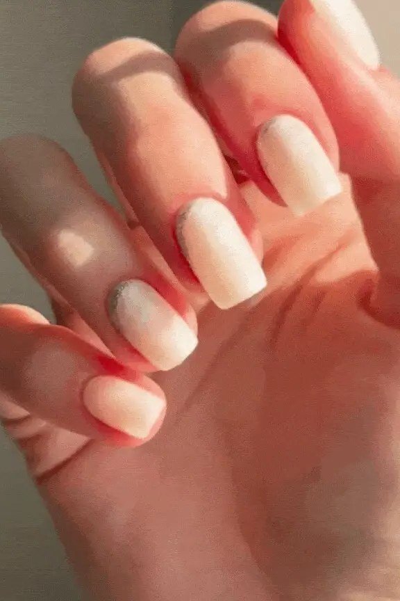 Ombre nude press-on nails glowing in sunlight