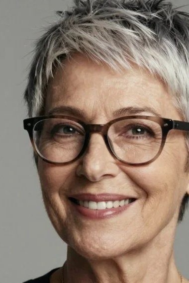 Neat tapered silver pixie for older women wearing glasses
