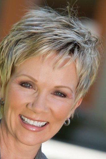 Textured salt-and-pepper pixie for older women, big smile