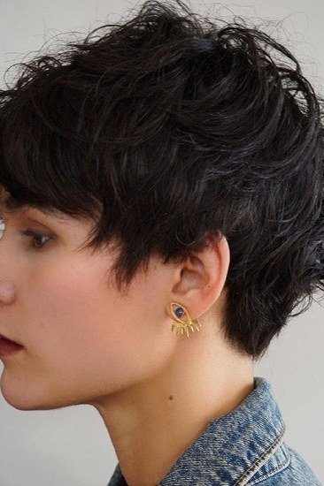Rich dark curly pixie for older women, side profile