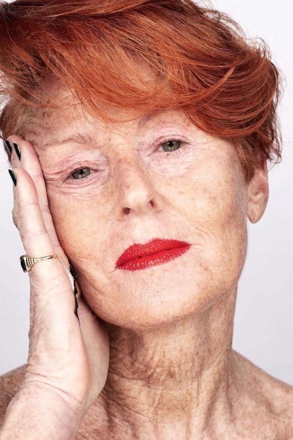 Copper-red pixie haircut for women over 60, bold color