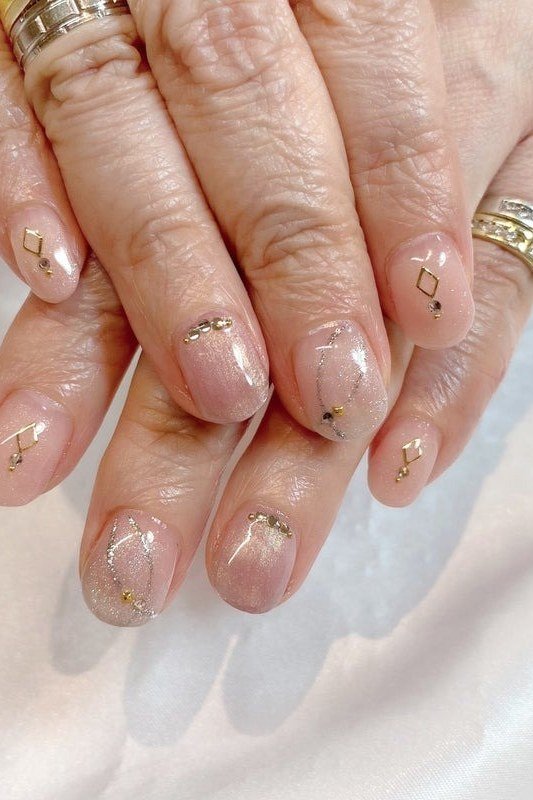Sheer with Tiny Gold Stars nail art for women over 50