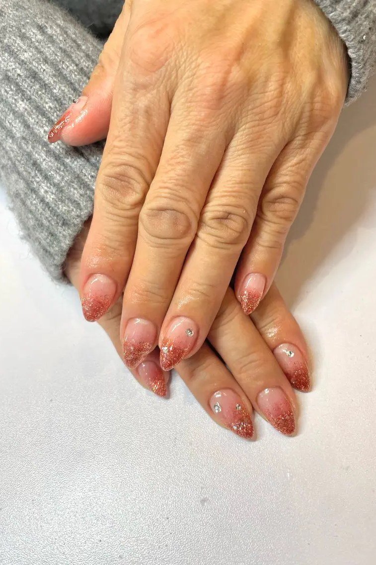 Nude-Pink Almond with a Grey Sweater - short almond nails for women over 50