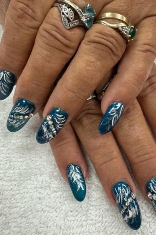 Teal Almond with White Floral Art - short almond nails for women over 50