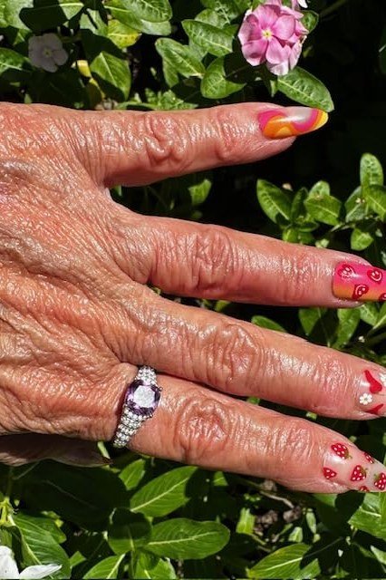 Colorful Floral Nail Art Outdoors - short almond nails for women over 50
