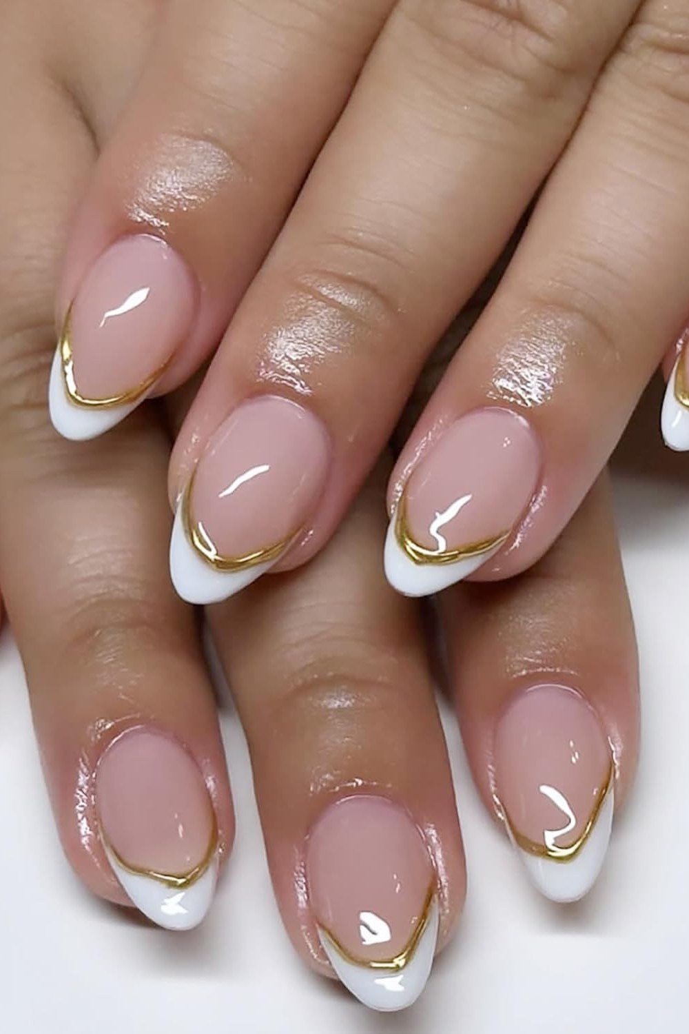 White French with Thin Gold Outline - short almond nails for women over 50