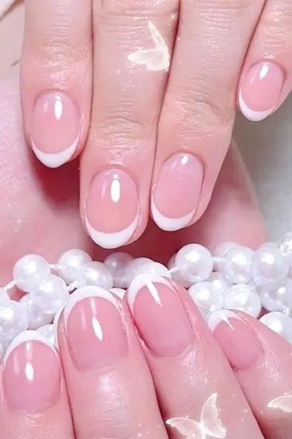 Pink French with Pearls and Butterflies - short almond nails for women over 50