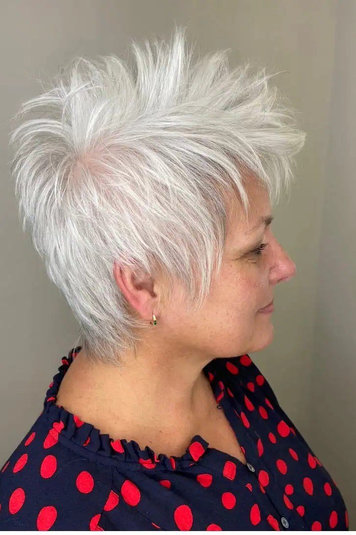 A sleek profile shows a white pixie with clean lines and a spiky crown.
