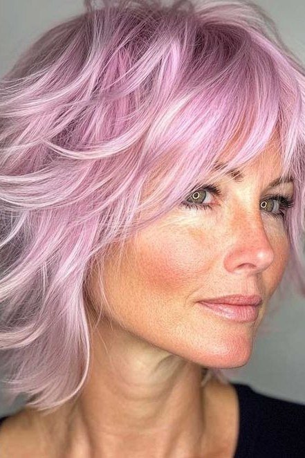 Pastel pink and shaggy layers make this bob a total dream.