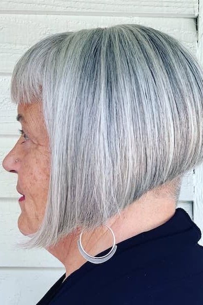 This silver bob is cut with a sharp angle, dramatic in front and sleek all over.