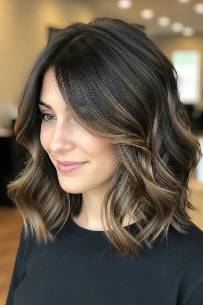 Brunette balayage wavy bob with curtain bangs for women over 60