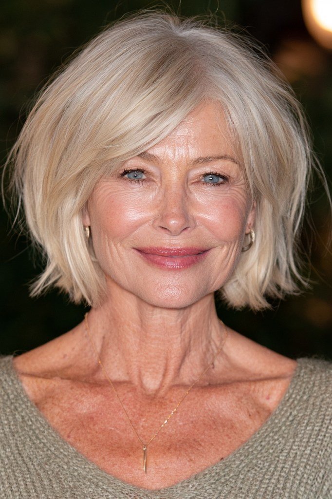 Champagne blonde bob with curtain bangs for older women