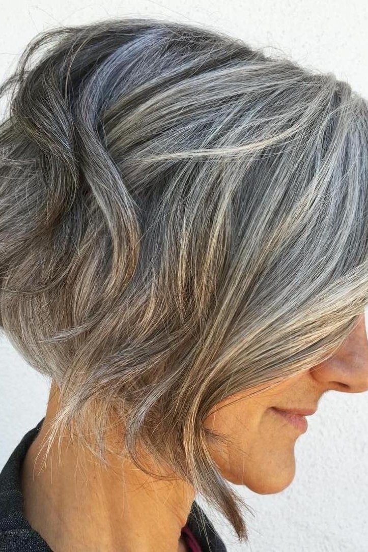 Asymmetric silver-gray bob with long side sweep for older women