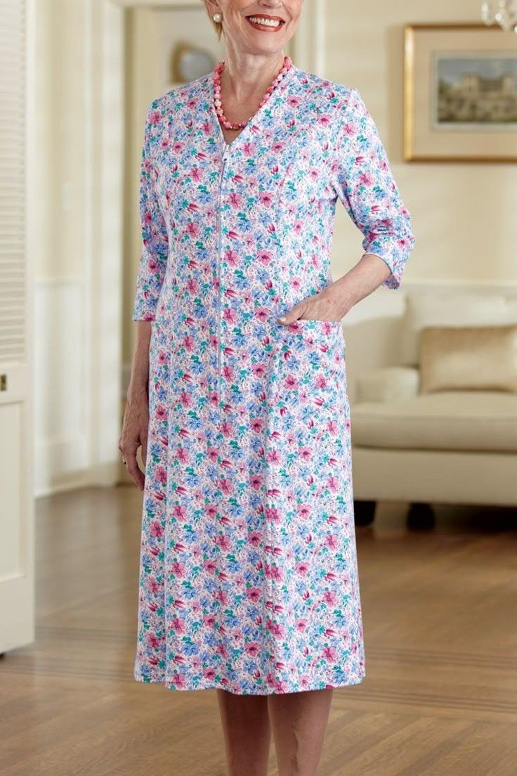 Pastel floral shirt dress for women over 60: tiny blue and pink flowers on a three-quarter-sleeve midi with a classic collar