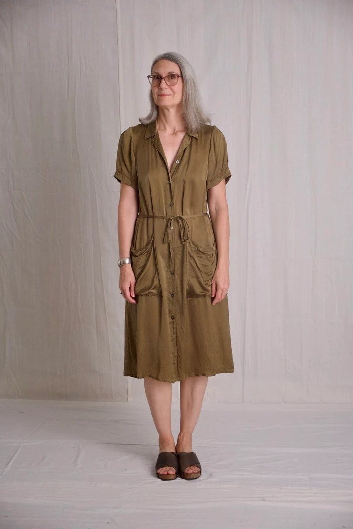Olive tie-waist shirt dress for women over 60: deep olive with short sleeves and a self-tie waist worn with slides