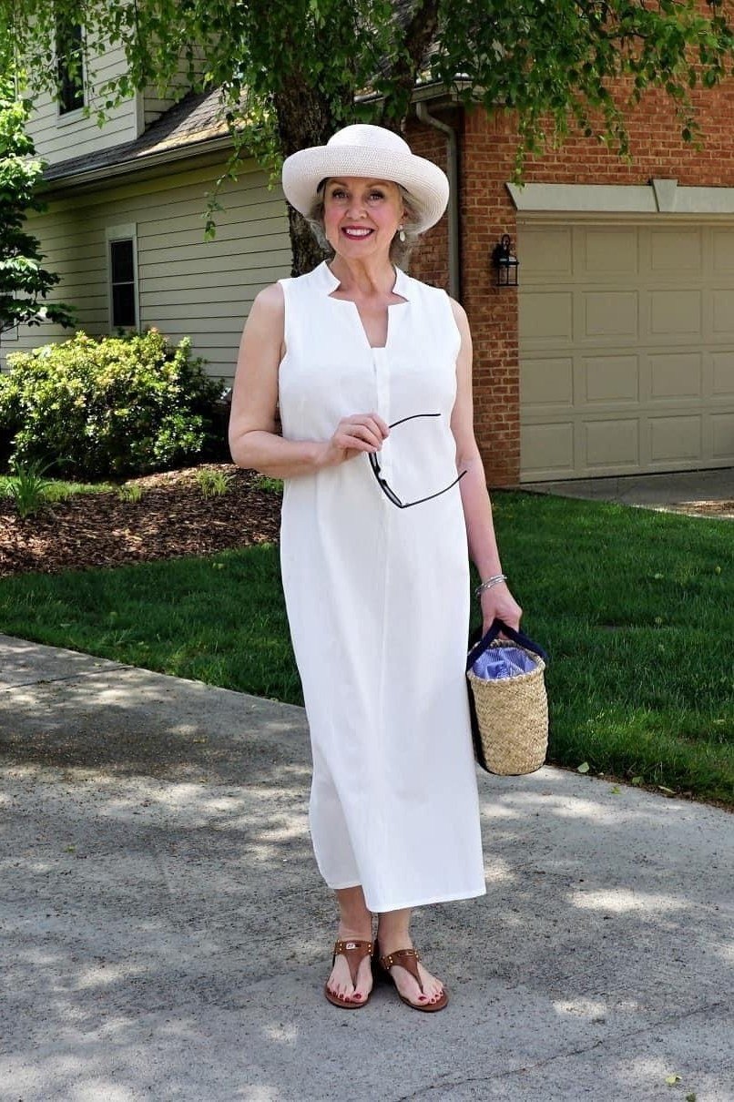 white sleeveless midi dress with hat for women over 60