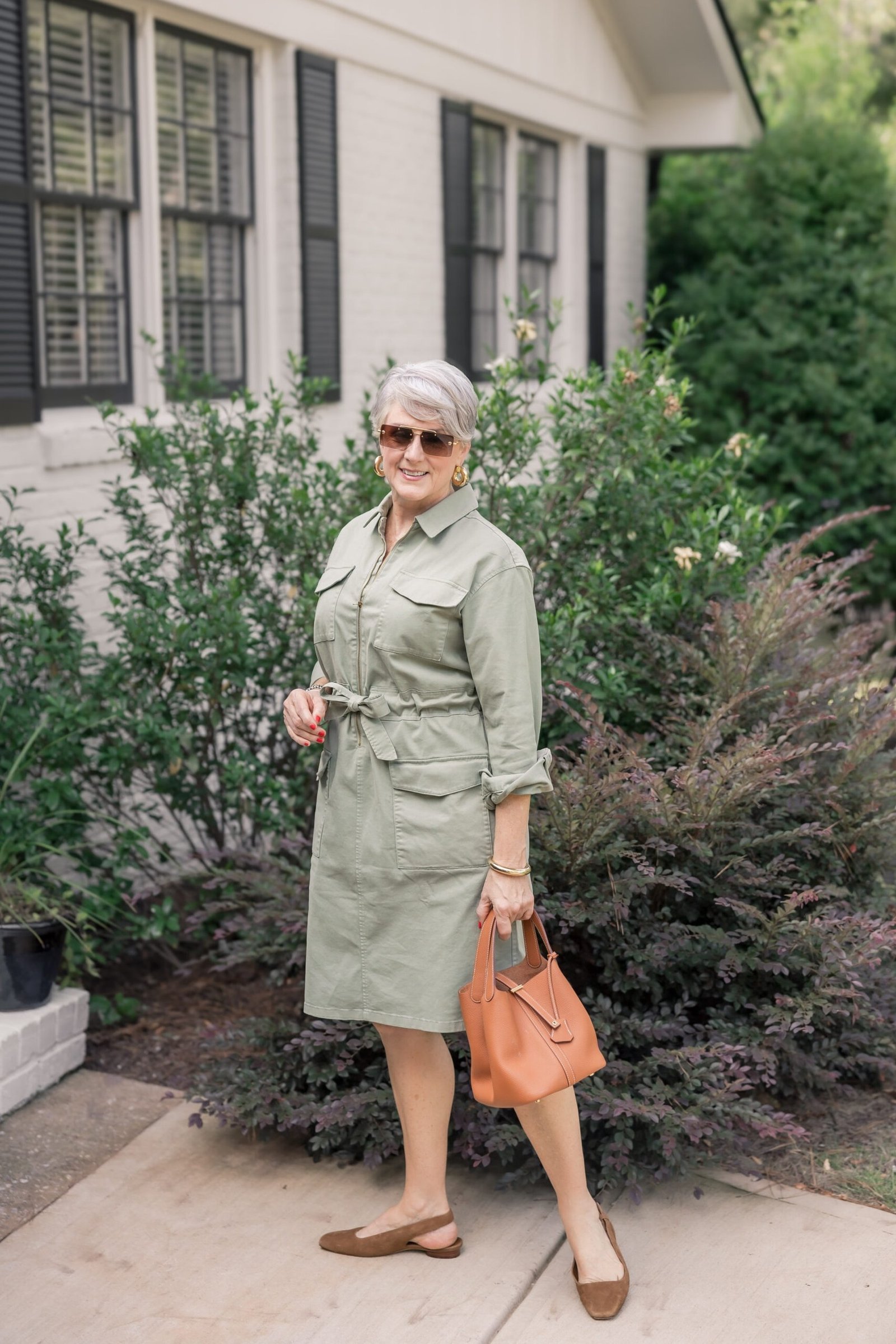 Sage safari shirt dress for women over 60: front-knotted tie belt with three-quarter sleeves and brown loafers