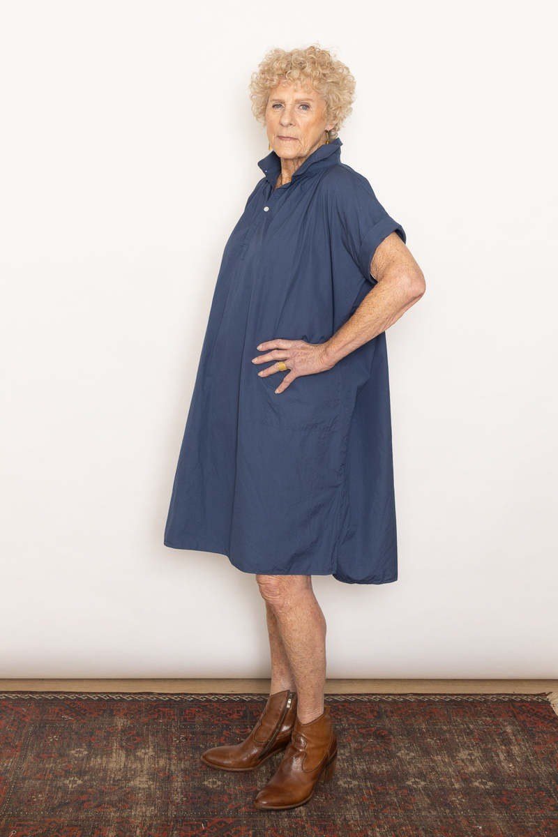 Steel-blue oversized shirt dress for women over 60: relaxed roomy cut with short sleeves and brown ankle boots