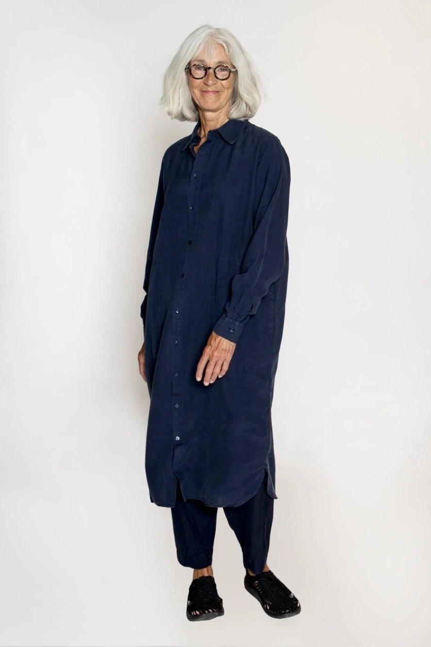 Navy shirt dress with matching pants for women over 60: dark navy long-sleeve dress layered over slim navy pants