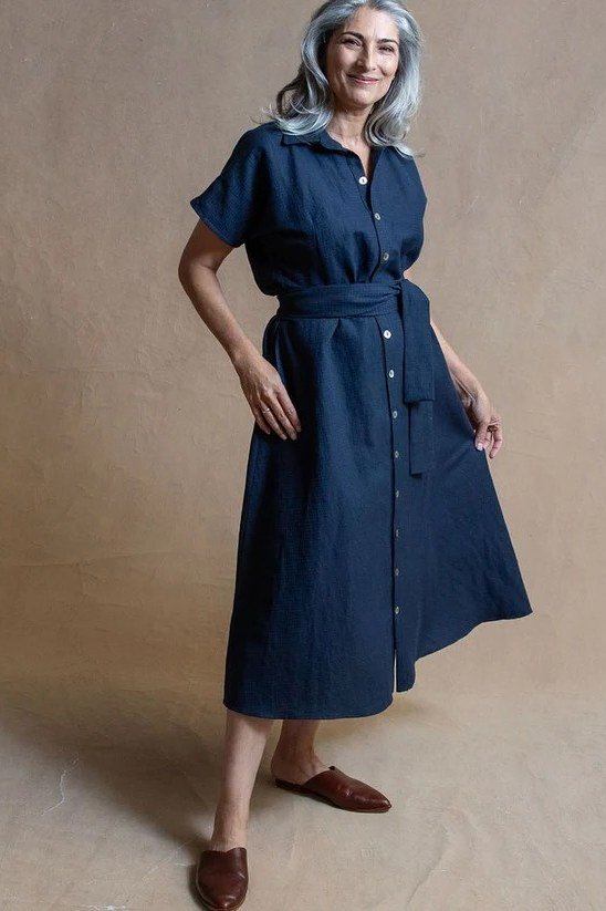 Navy midi shirt dress for women over 60: dark navy with short sleeves and a tie belt worn with brown mules