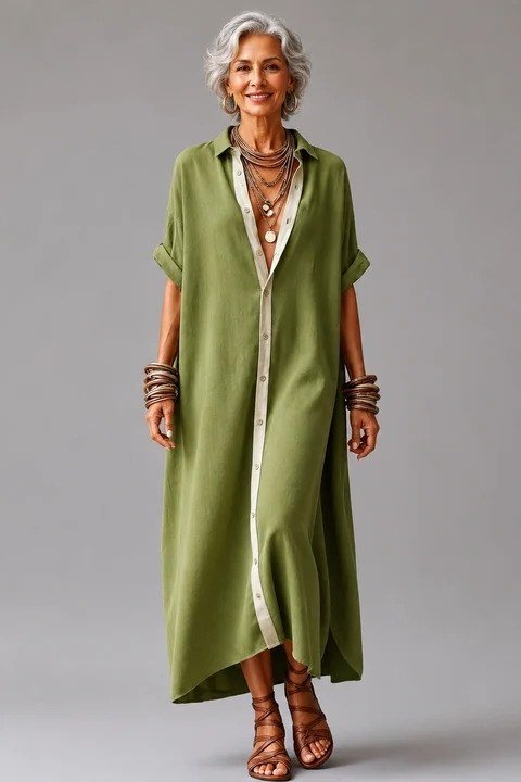 Olive maxi shirt dress for women over 60: rich olive with a cream front stripe, layered necklaces and strappy sandals